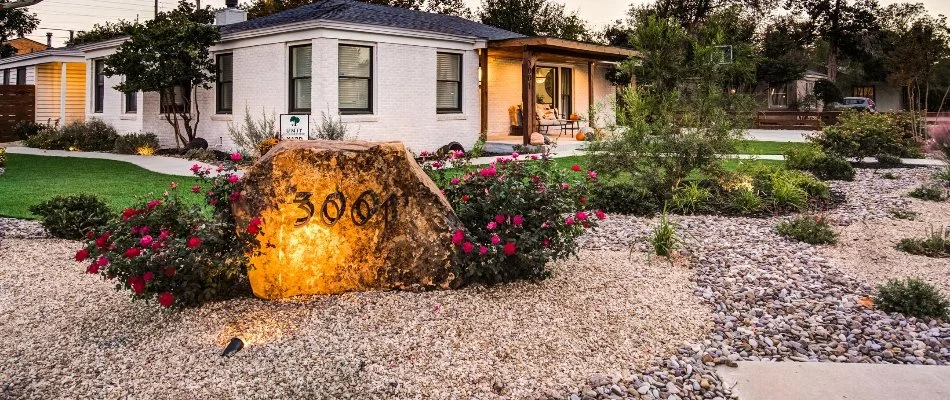 Home in Plainview, TX, with atmospheric outdoor lighting.