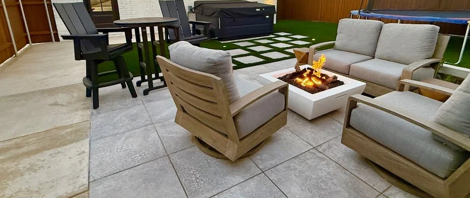 Gray chairs around a fire pit on a patio in Lockney, TX.