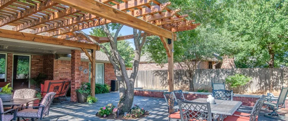 Patio in Floydada, TX, with a pergola and large tree.