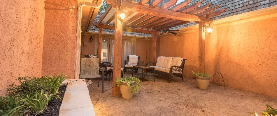 A pergola, patio, and seating in an outdoor space in Wolfforth, TX.